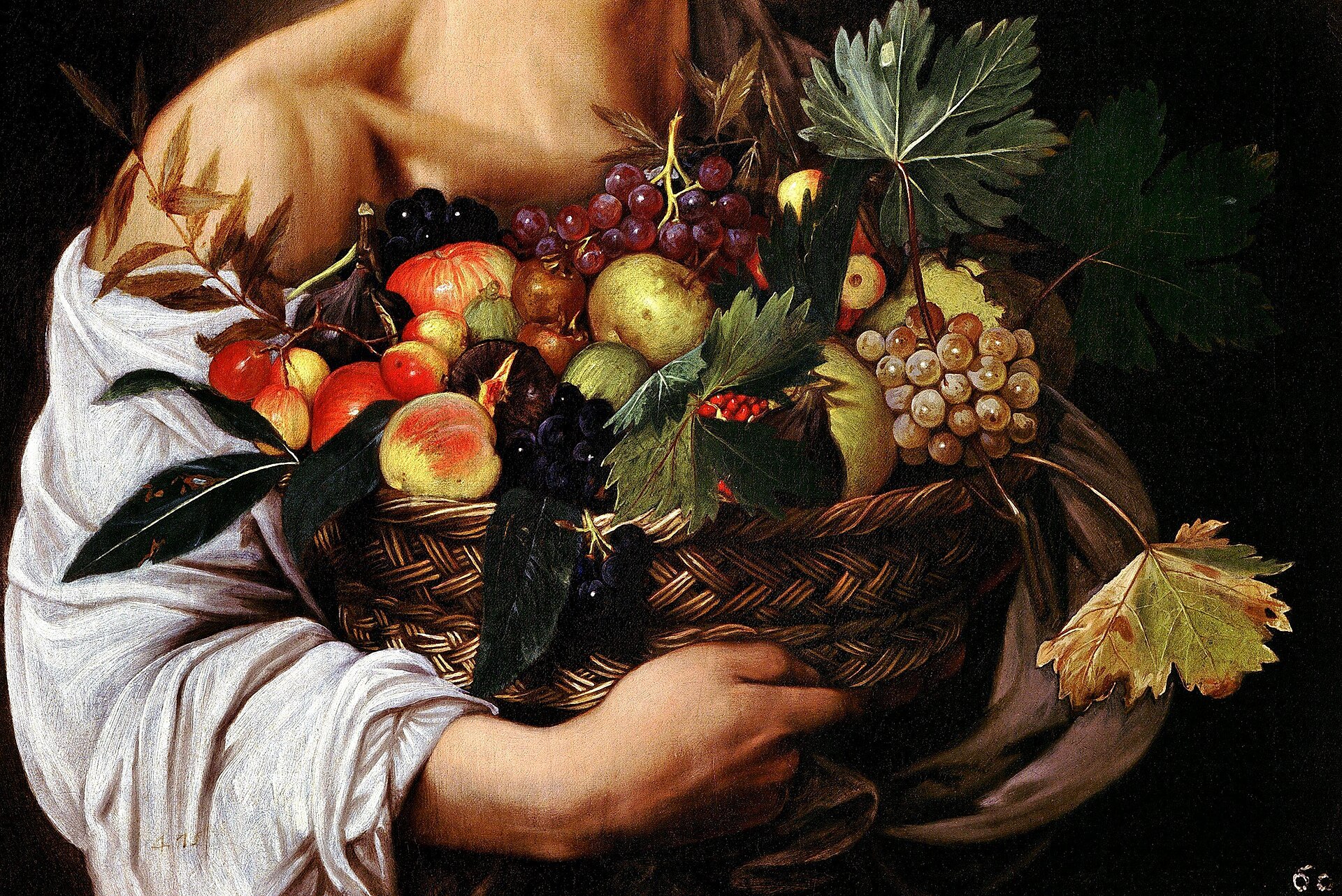 El detalle de la cesta de frutas, con sus hojas secas