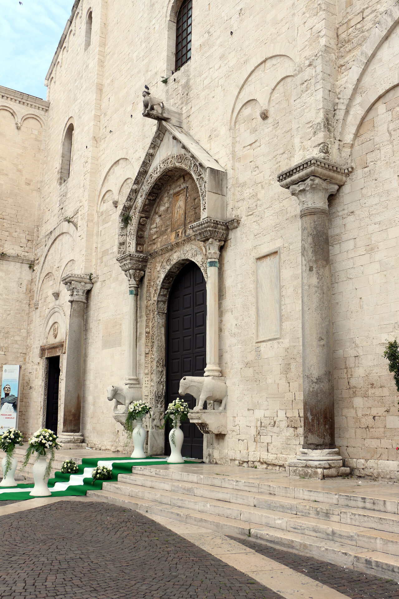 the west front of the basilica of san nicola in bari with the central portal and the two truncated towers