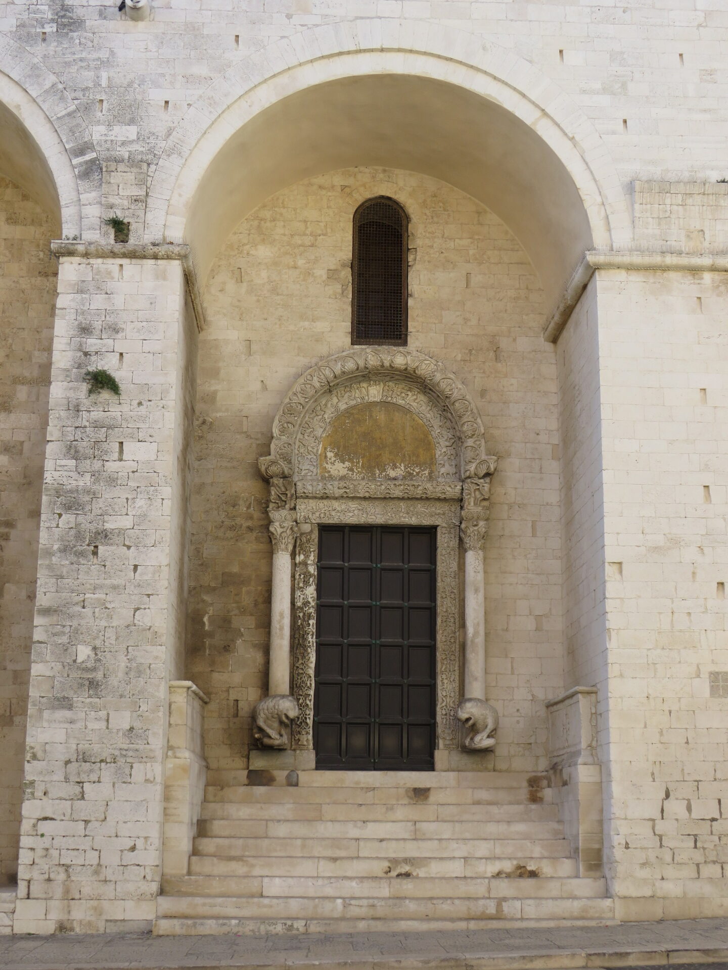 the porta dei leoni on the north flank of the basilica of san nicola in bari with its two stone lions