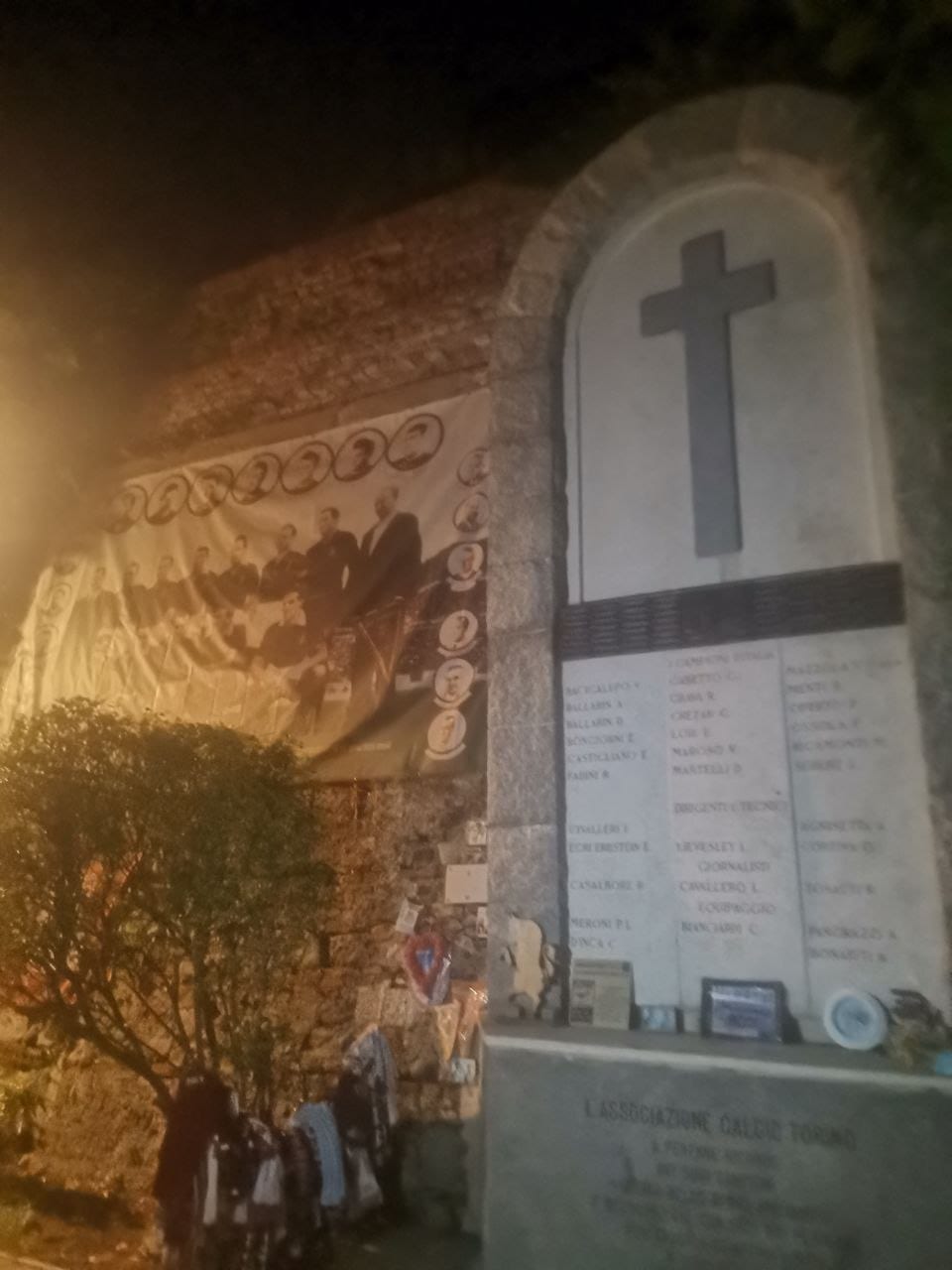 the memorial stone to the grande torino disaster behind the apse of the basilica of superga