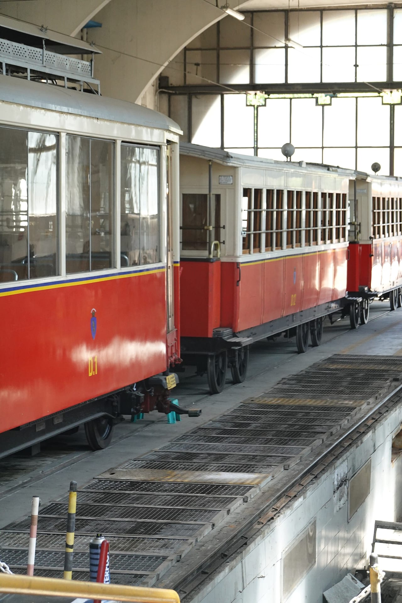 the historic red and cream carriages of the sassi superga rack tram in the sassi depot