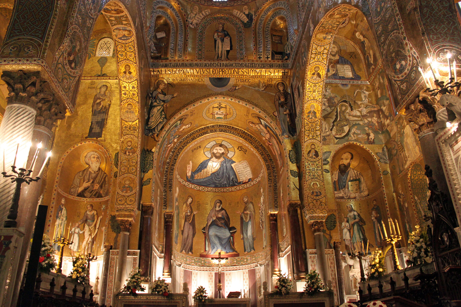 the nave of the palatine chapel in palermo with its golden mosaics and christ pantocrator at the end