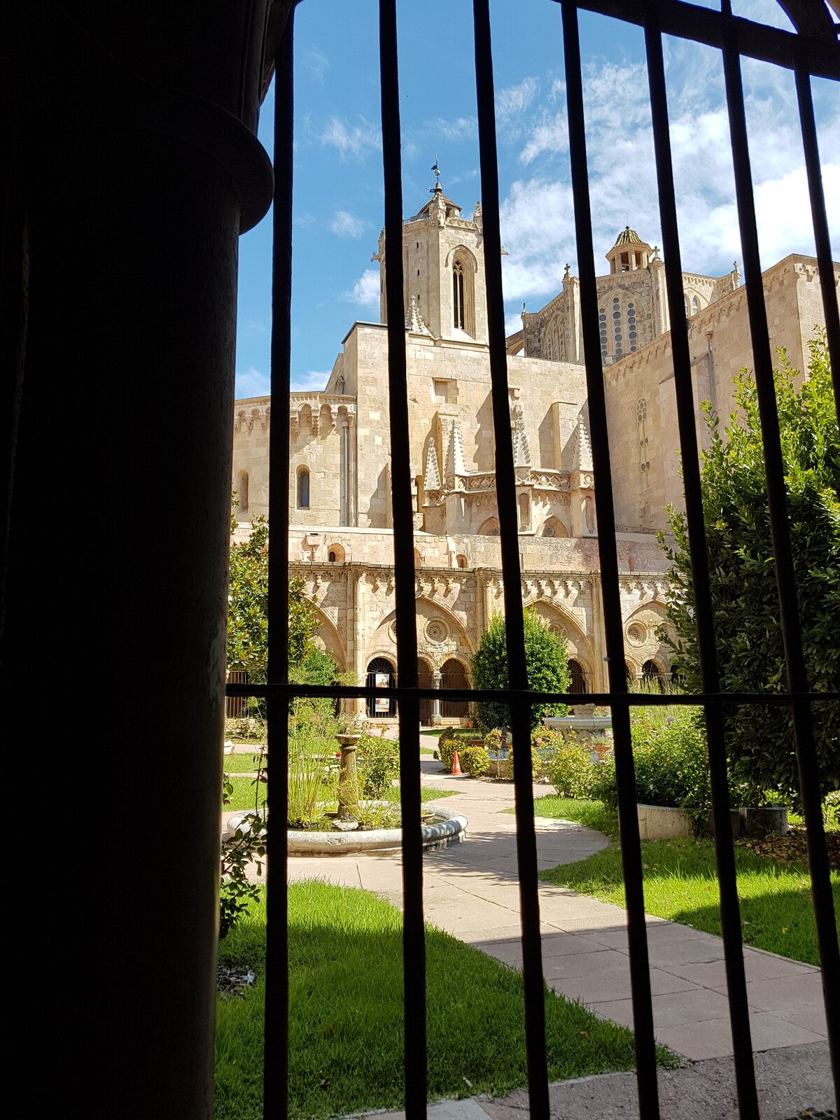 the cloister of Tarragona Cathedral with the bell tower and the lantern behind