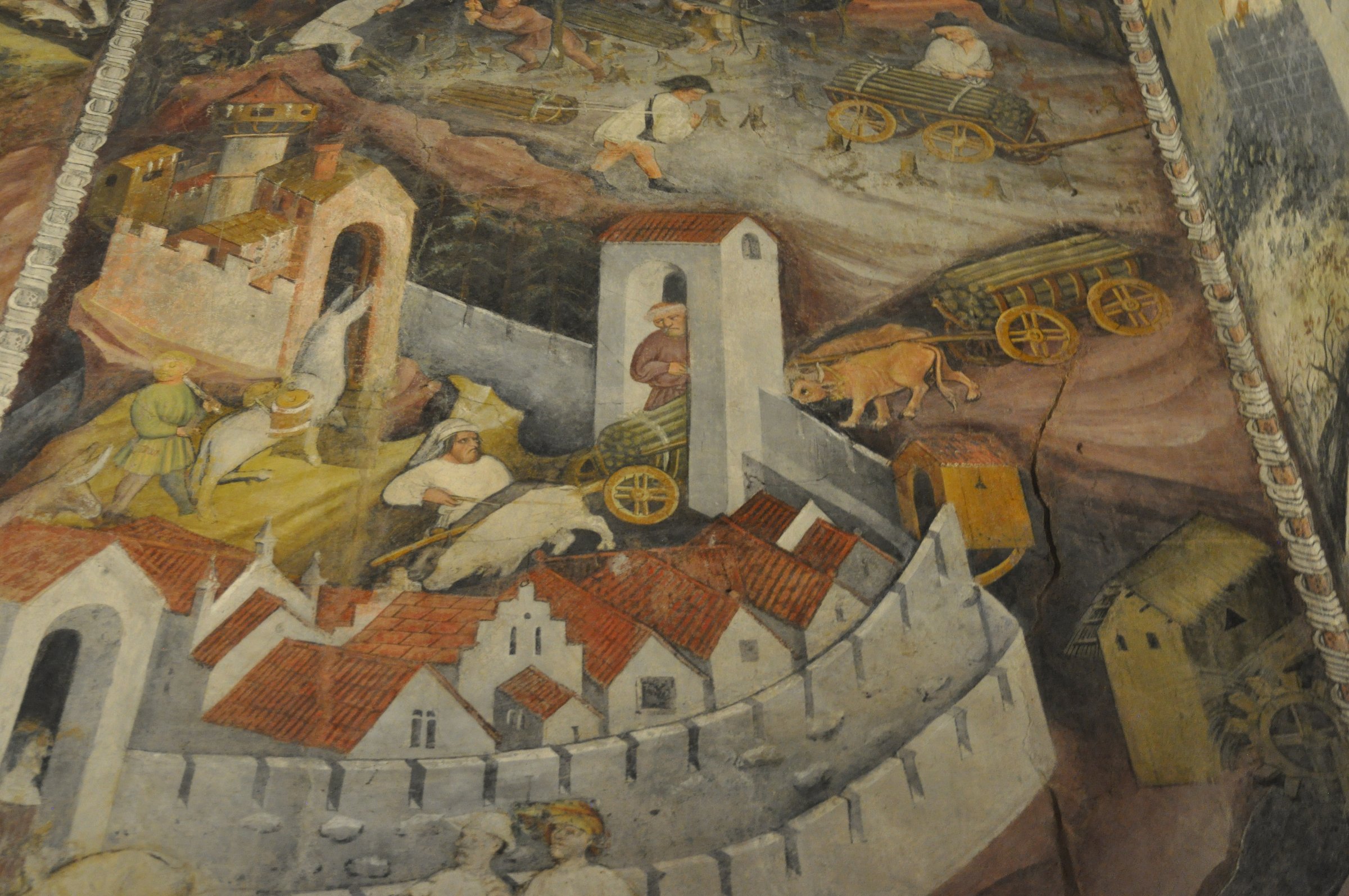 il riquadro di novembre e dicembre del ciclo dei mesi con i boscaioli i carri di legna e le mura di trento