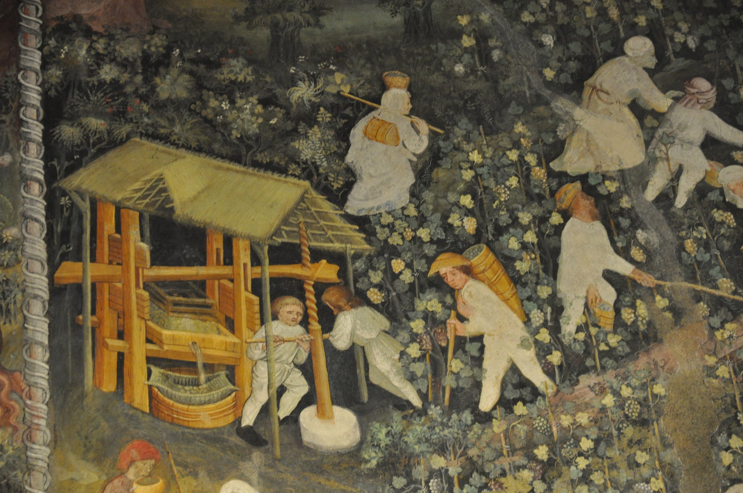 il mese di ottobre del ciclo dei mesi di torre aquila con la vendemmia il torchio e i contadini fra i filari