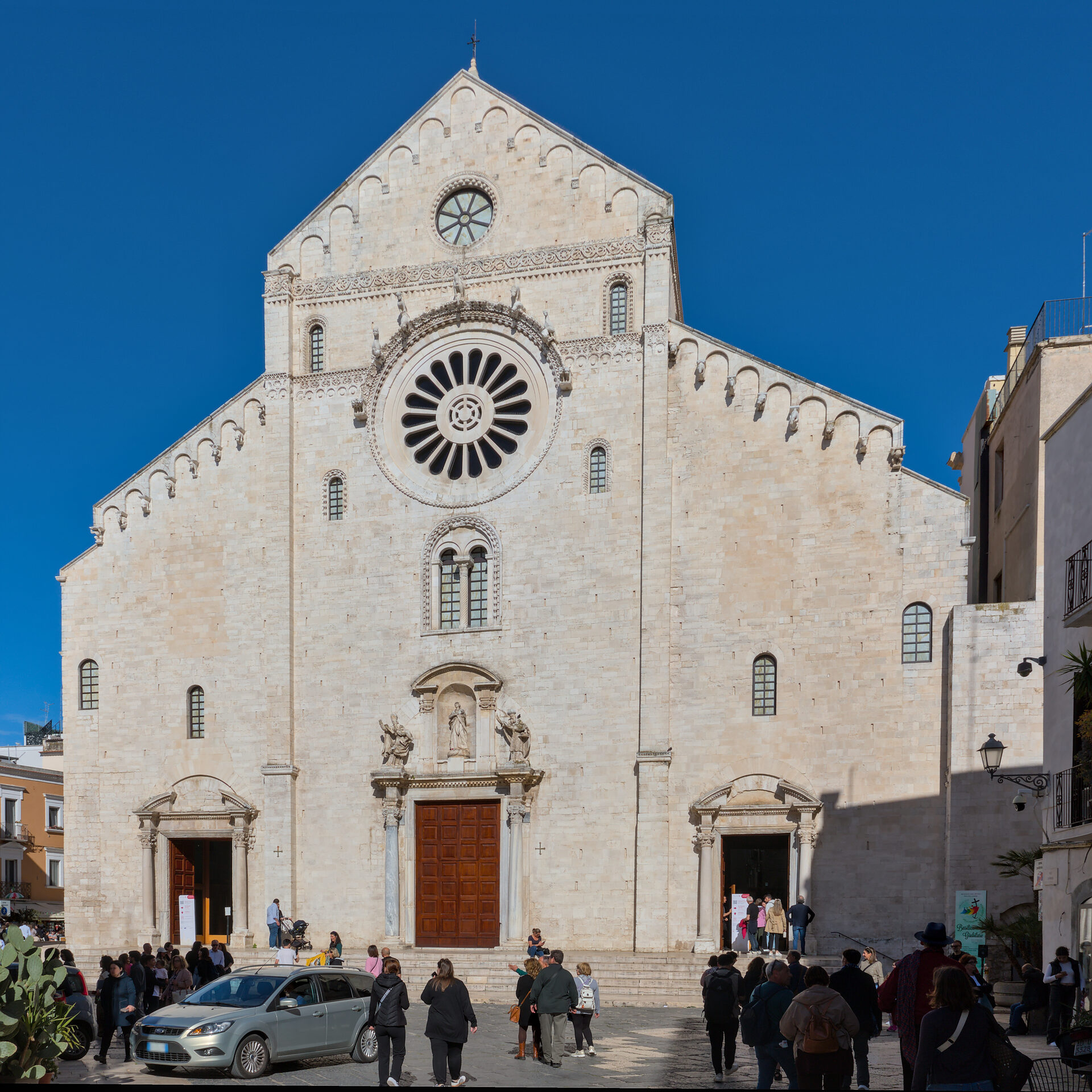 the façade of the cathedral of san sabino in bari with its rose window and three portals