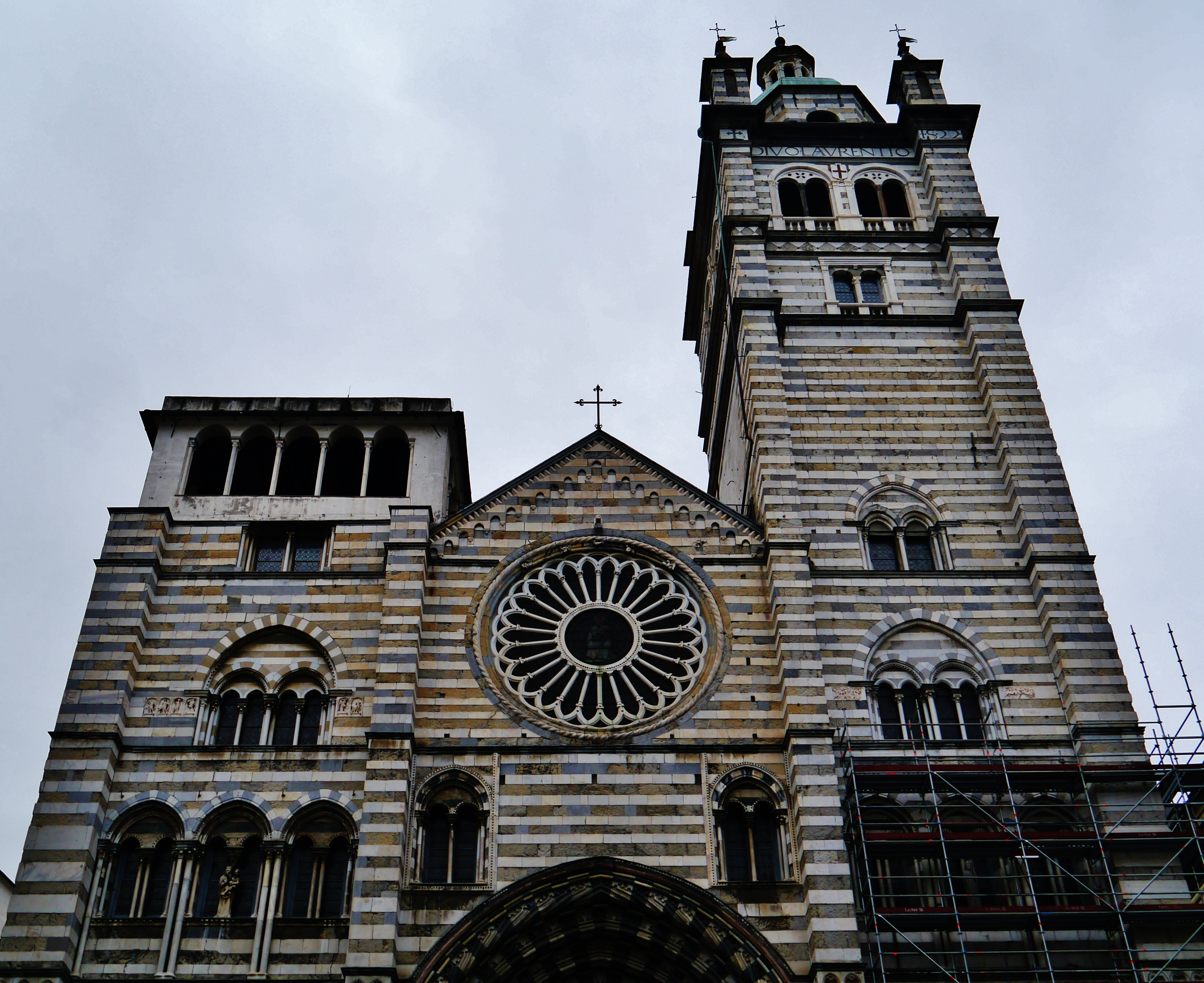 black and white striped facade of san lorenzo cathedral in genoa