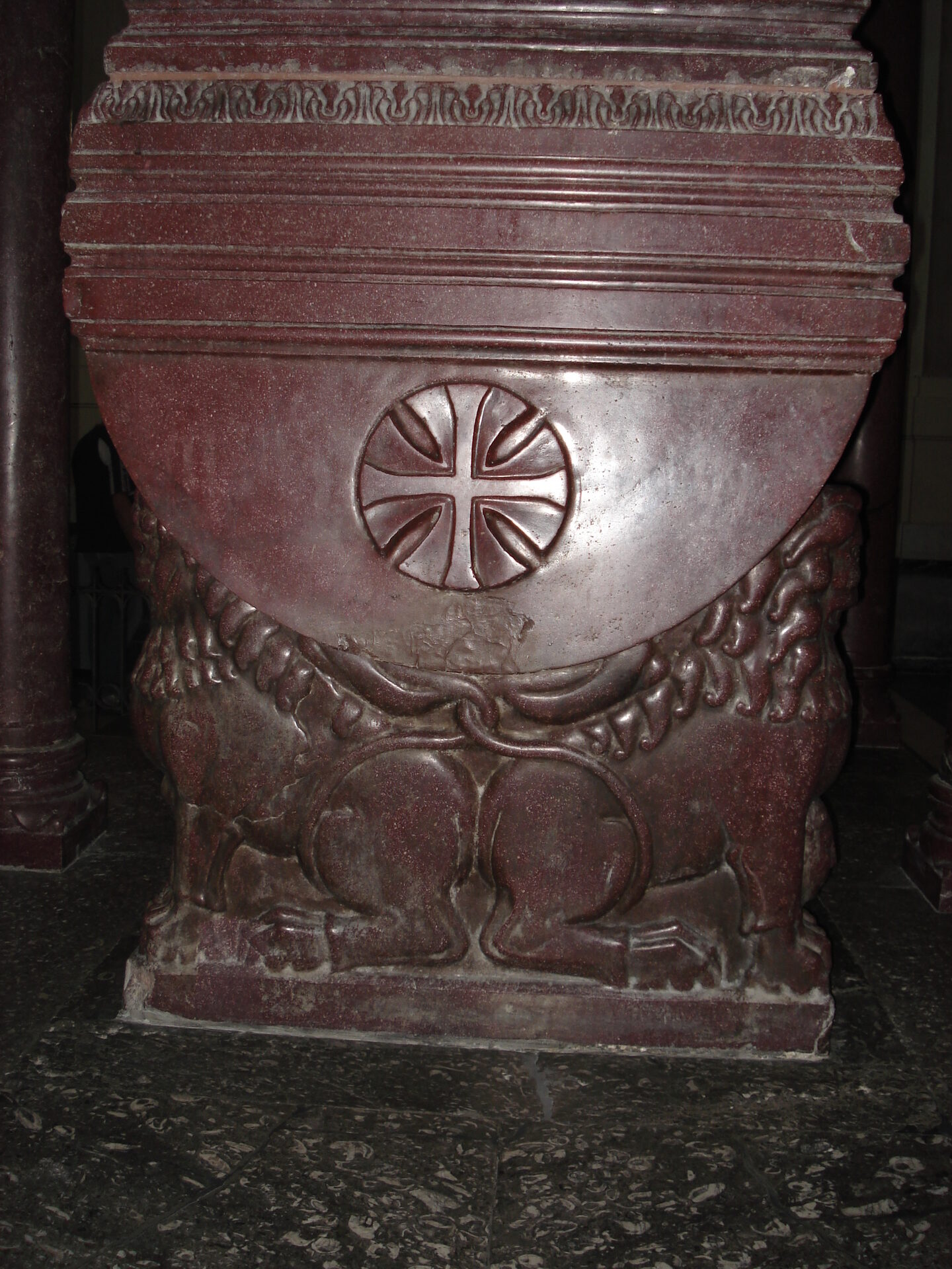 the red porphyry sarcophagus of frederick ii in palermo cathedral held up by stone lions