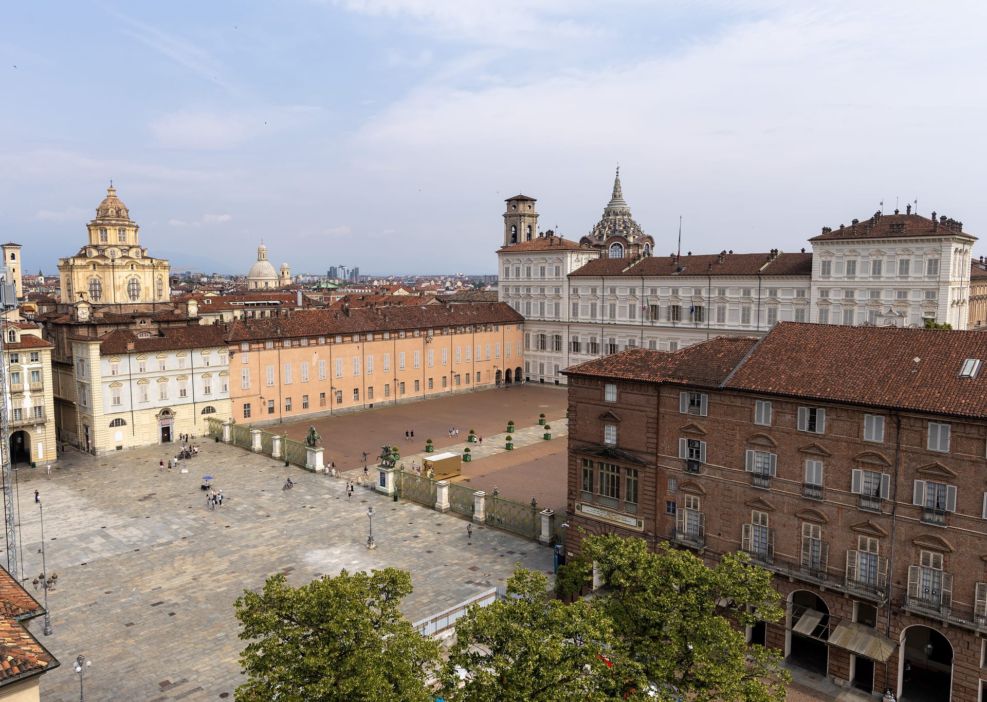 the courtyard of the royal palace in turin with its arcade and the cobblestone pattern in the paving