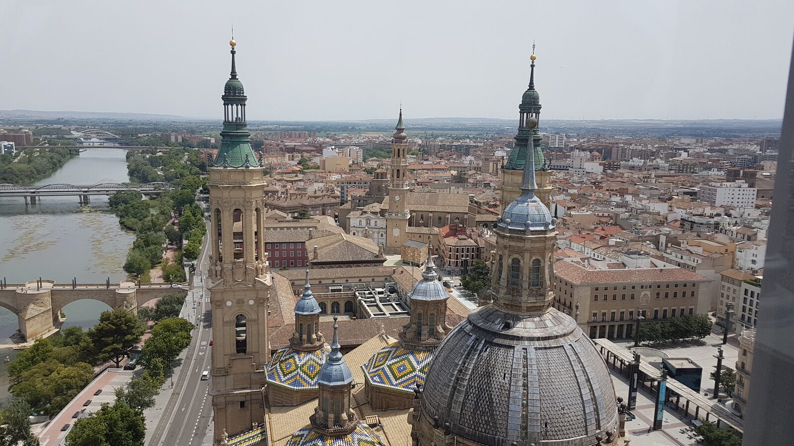 Zaragoza seen from the Torre Mirador of El Pilar, with the Ebro, the bridges and the basilica’s glazed tiled domes