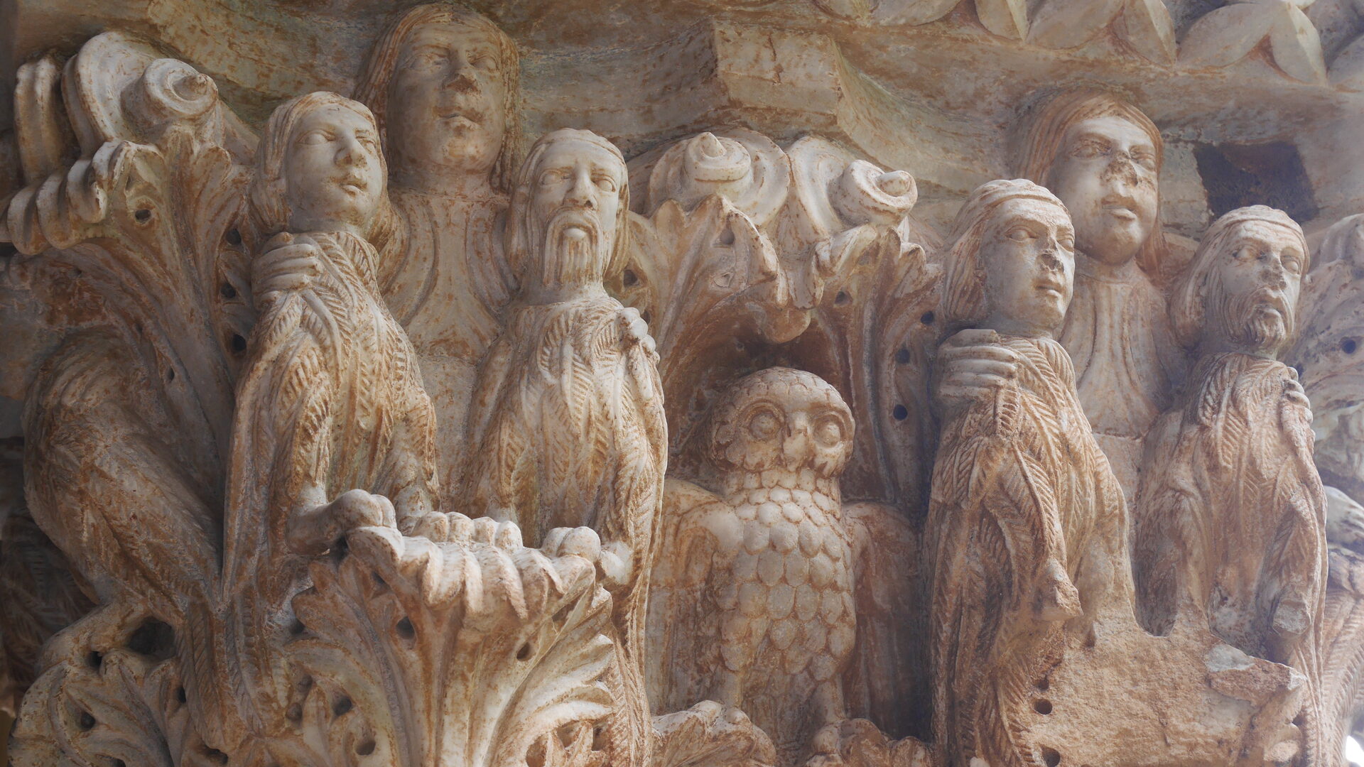 a capital of the monreale cloister carved with human figures and animals