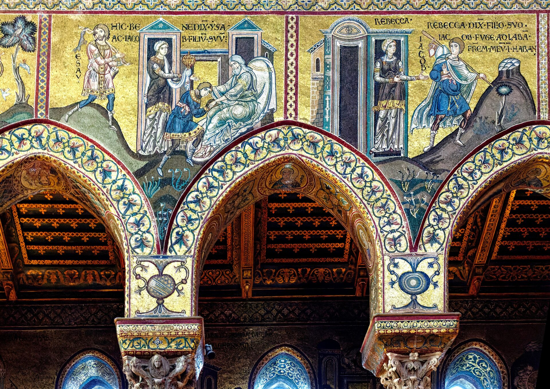 the arches of the nave of monreale cathedral faced with golden mosaic