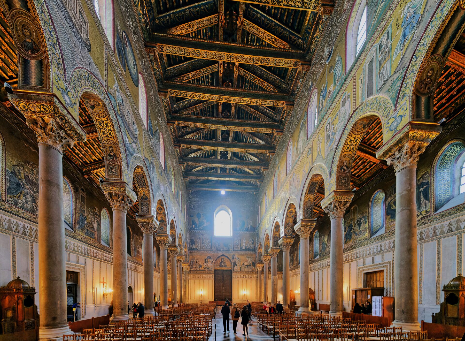 the nave of monreale cathedral with gold ground mosaics and the painted timber roof