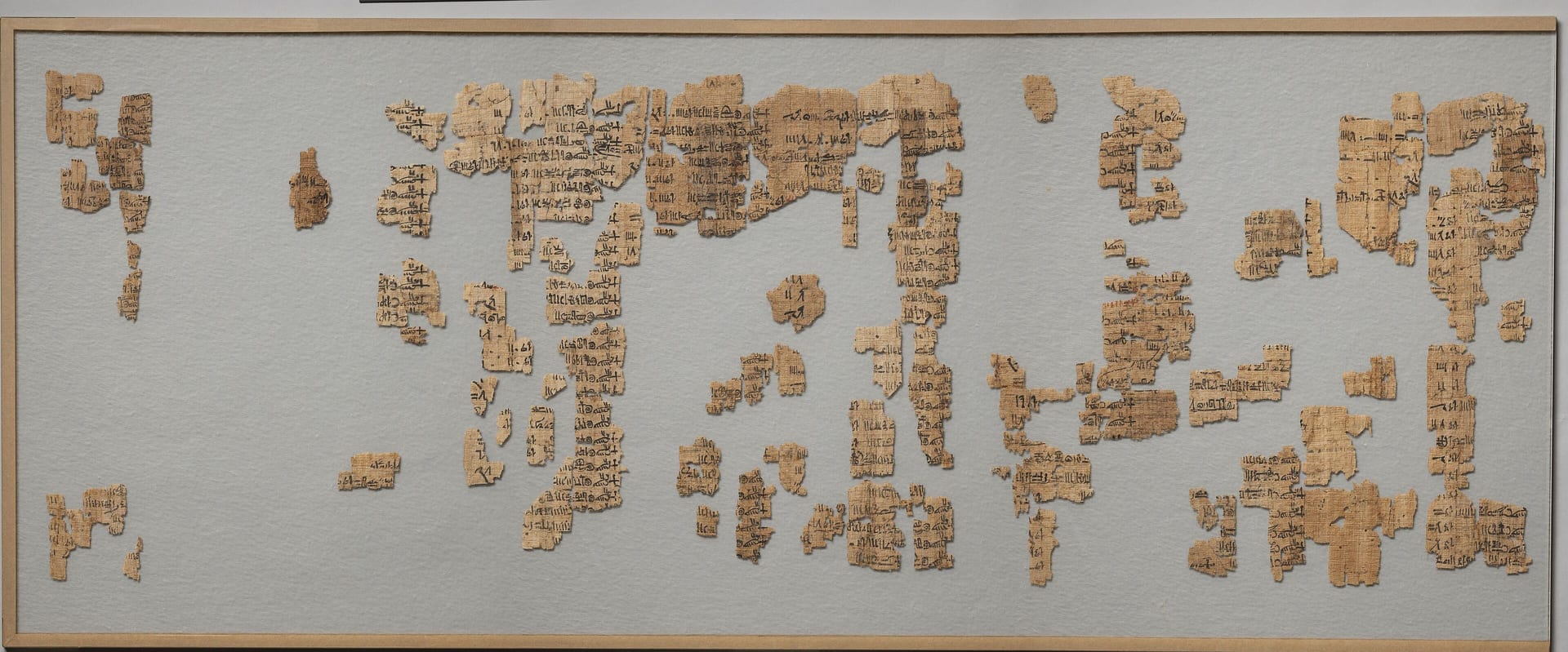 the turin king list, the papyrus with the list of egyptian kings kept in a frame like a mosaic of fragments