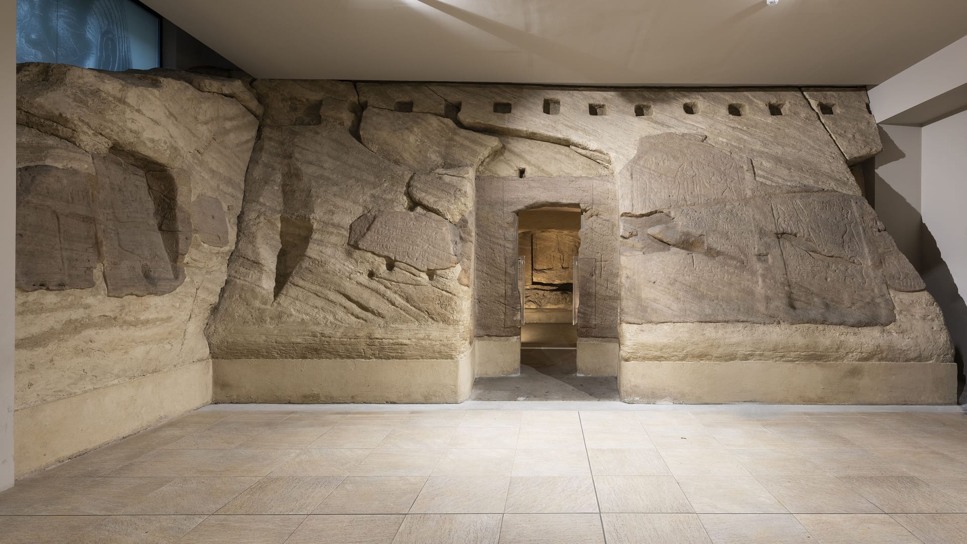the rock cut temple of ellesiya reassembled at the museo egizio in turin, with the sandstone wall and the doorway of the shrine