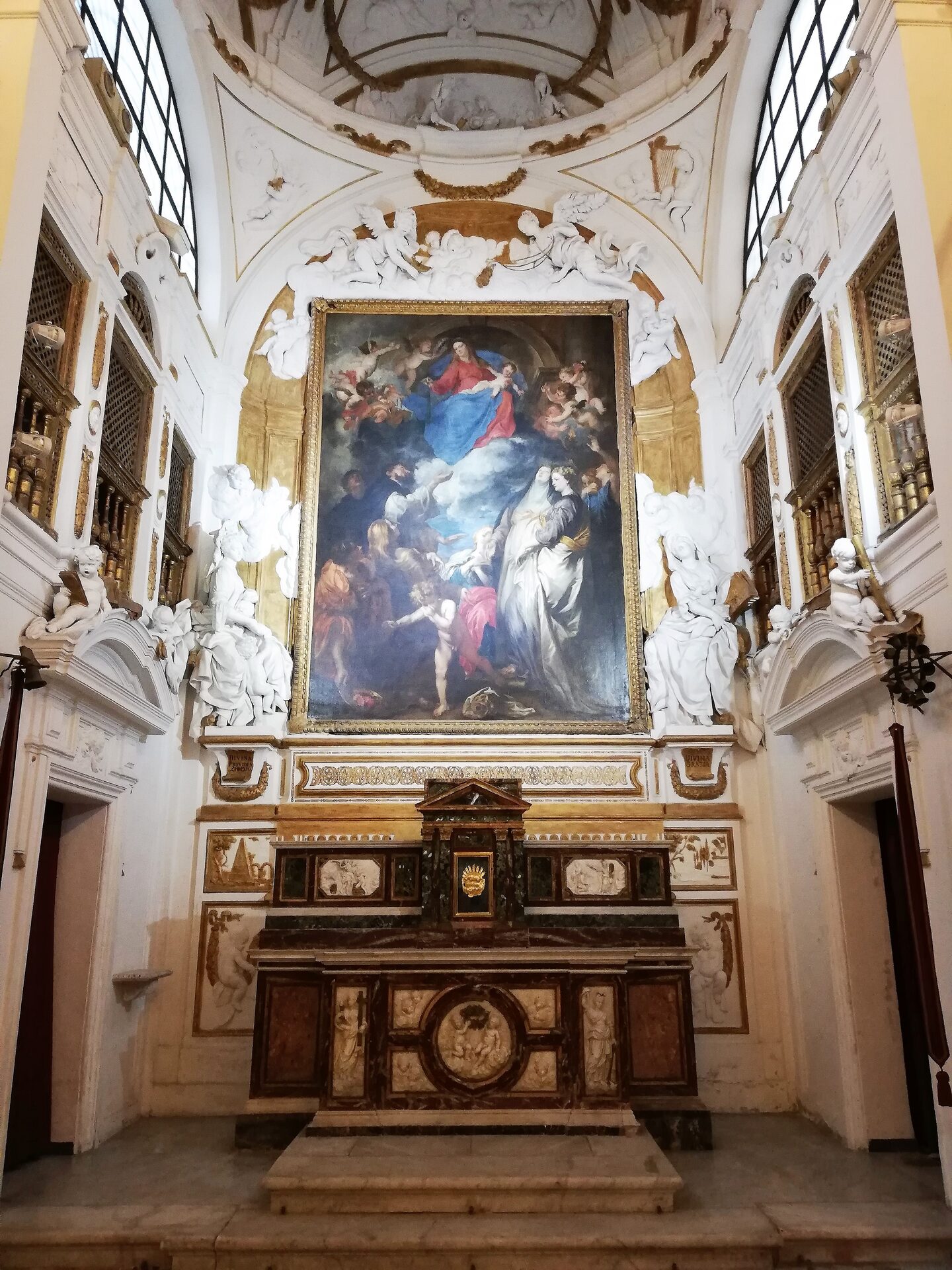 van dyck's madonna of the rosary on the altar of the oratory of san domenico
