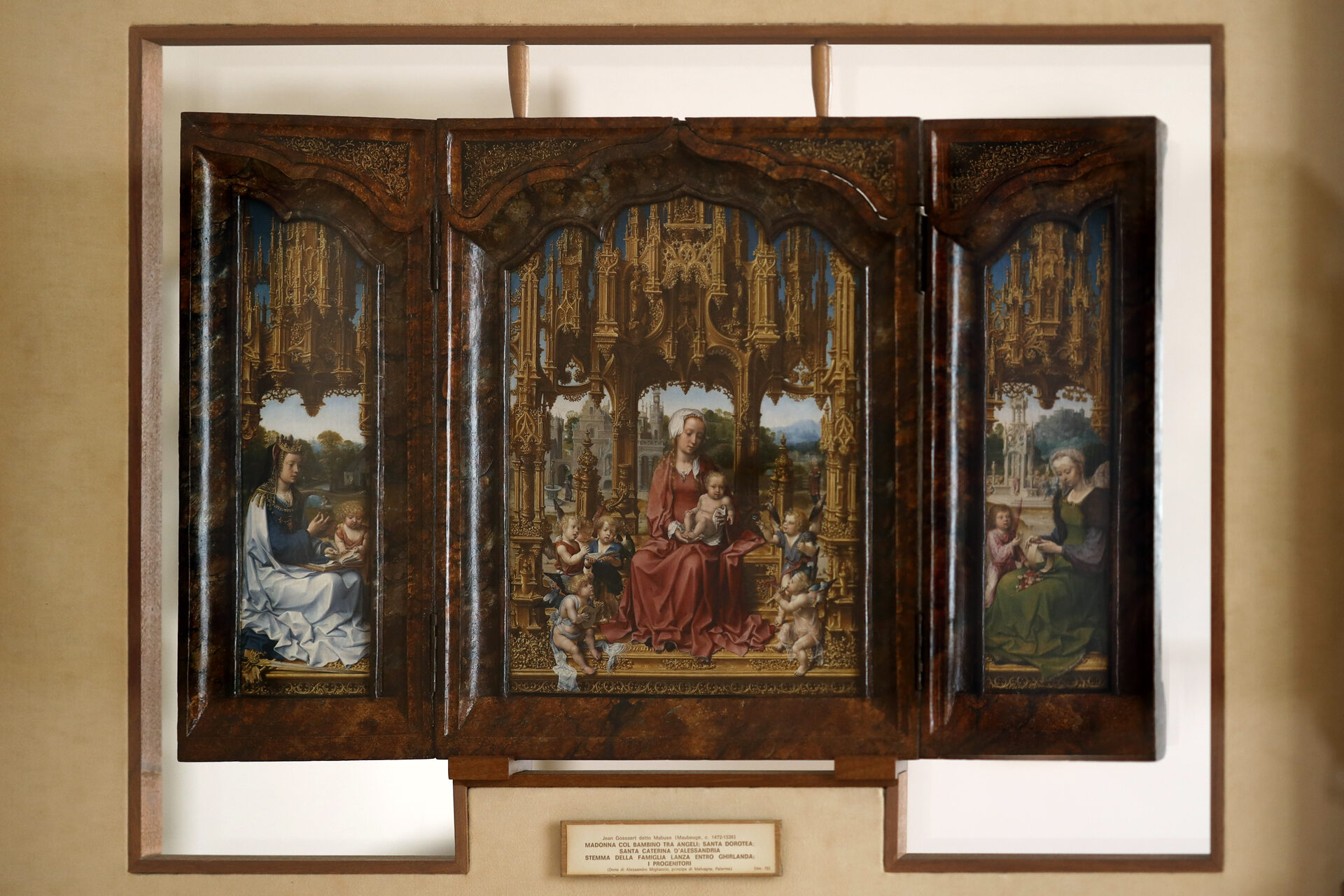 the malvagna triptych by jan gossaert open with its painted wings