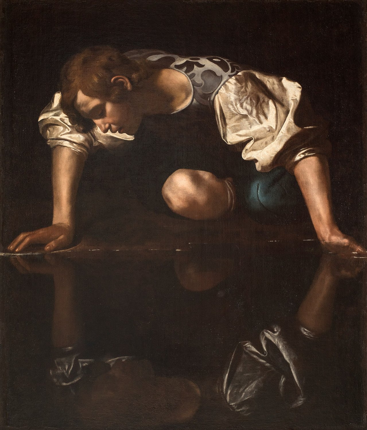 il Narciso attribuito a Caravaggio, un giovane chino sulla riva a guardare il proprio riflesso nell'acqua