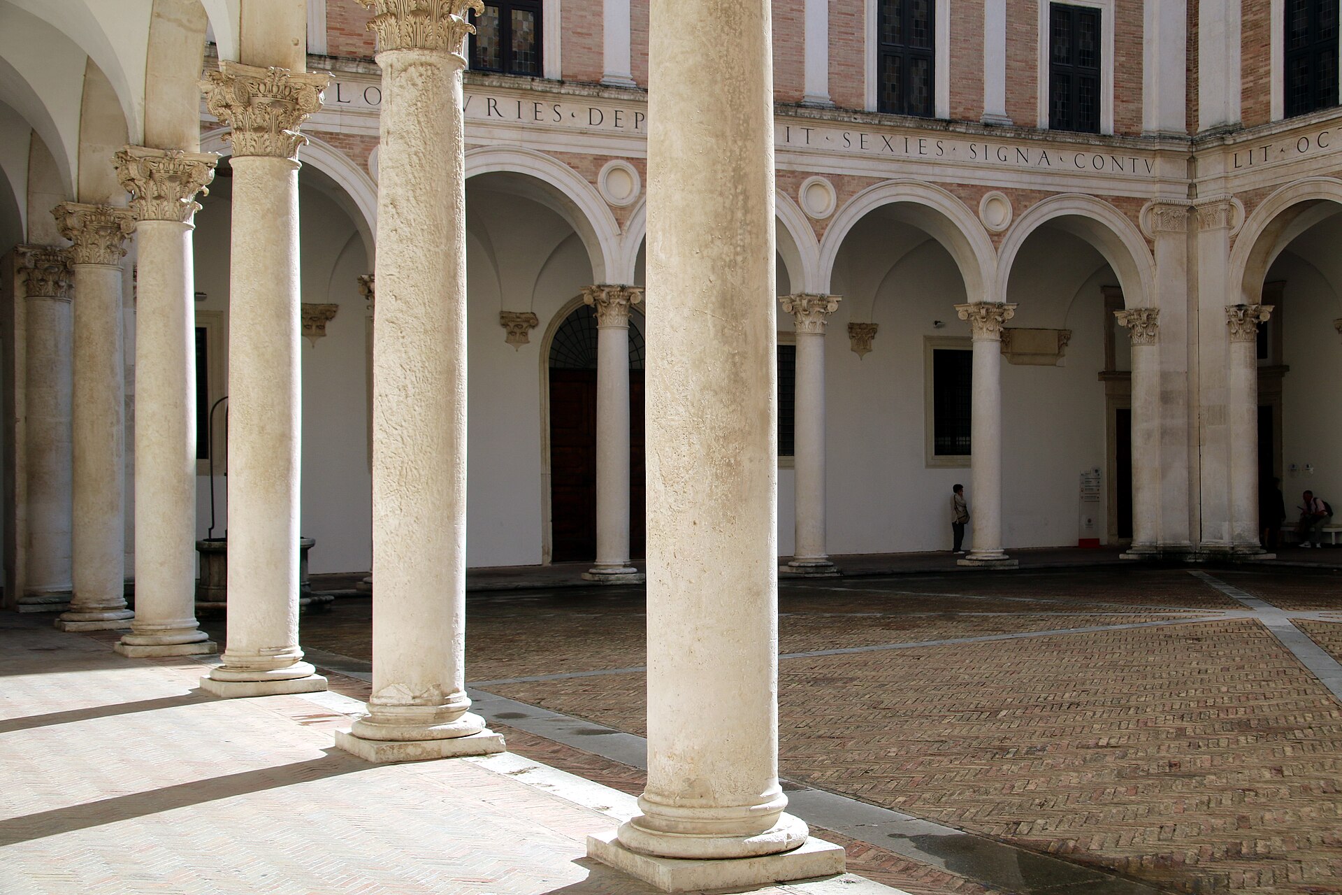 luciano laurana’s courtyard of honour with the corinthian colonnade and the inscribed frieze