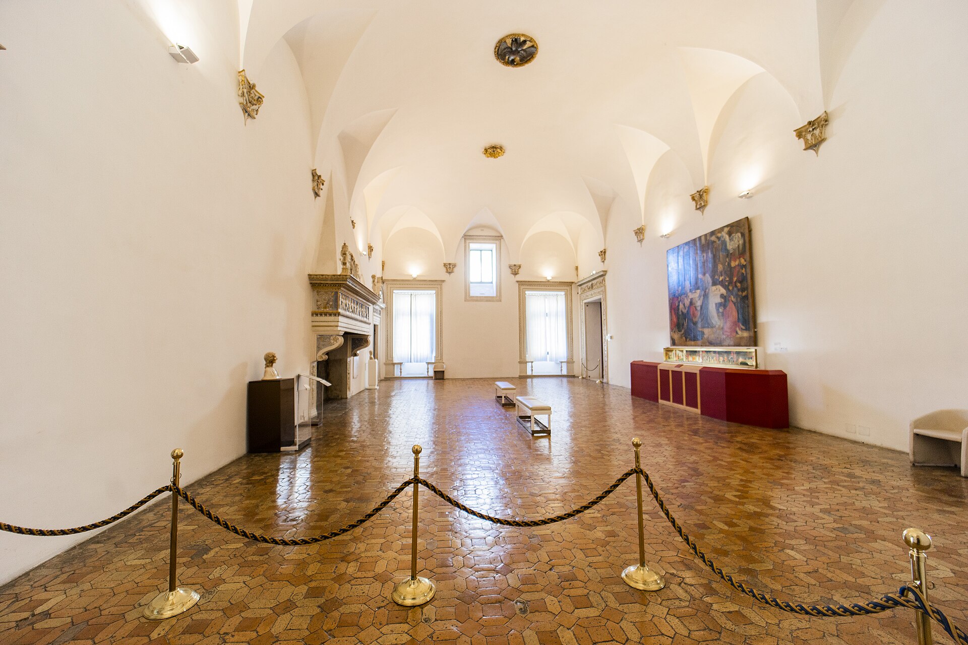 sala degli angeli on the piano nobile with domenico rosselli’s fireplace and a painting on display