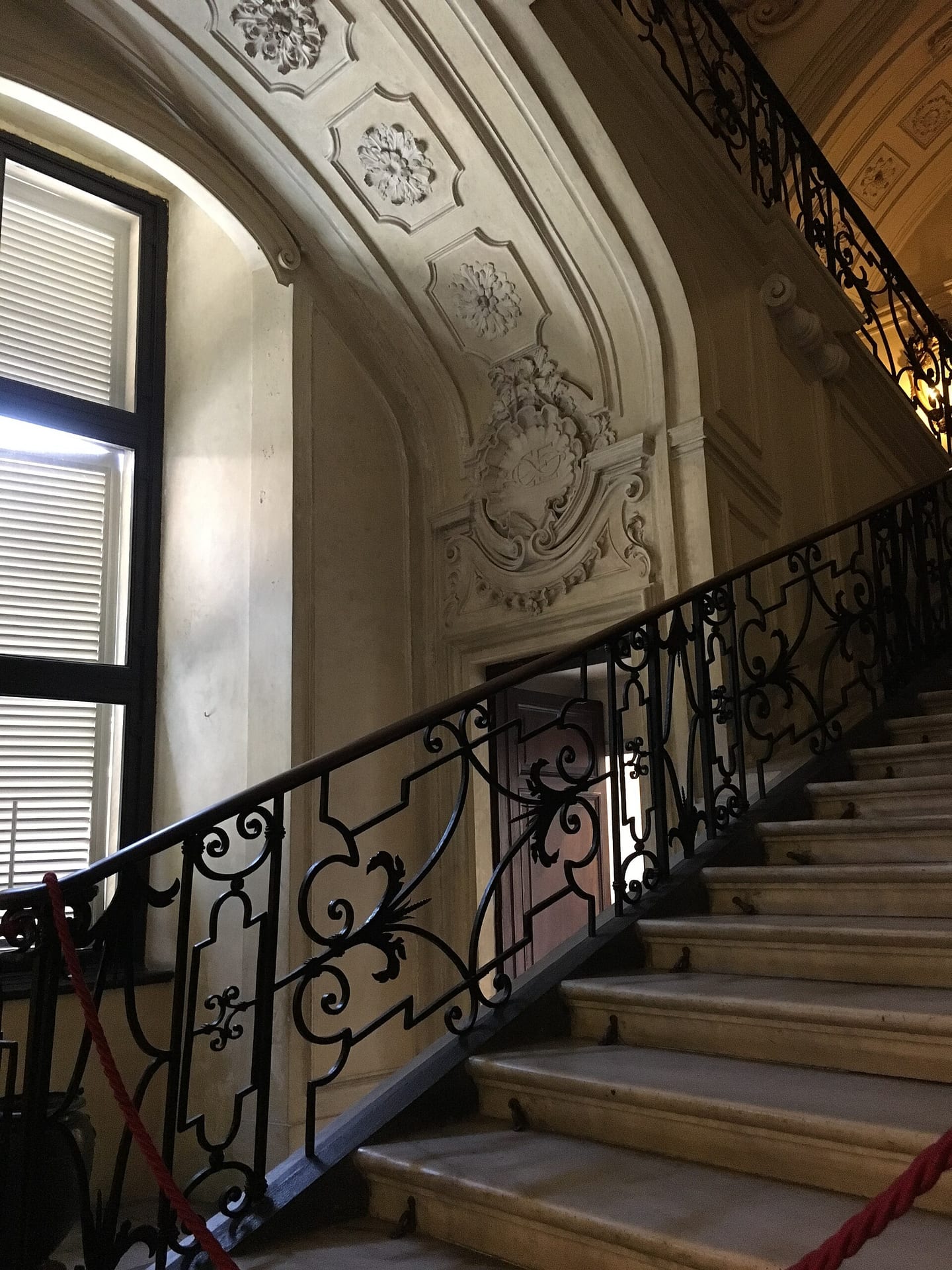 the scala delle forbici by filippo juvarra at the royal palace in turin, with its crossing flights and wrought iron balustrade