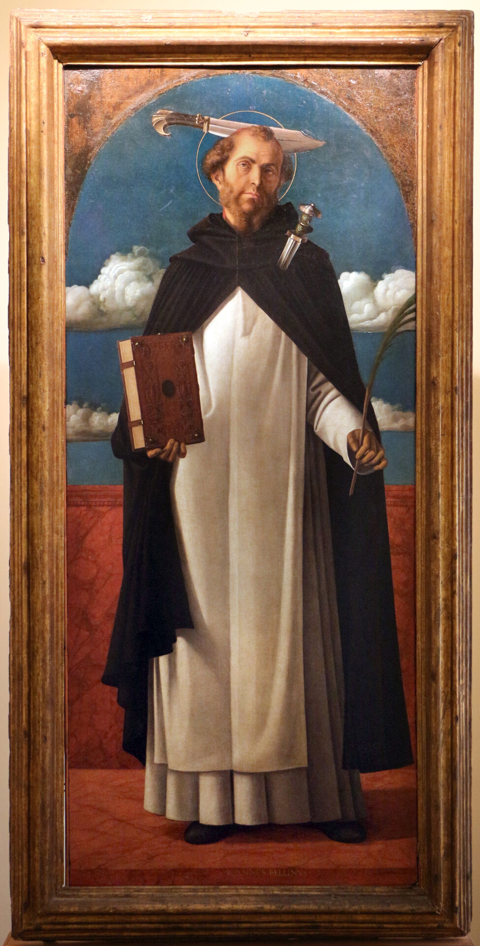 giovanni bellini’s san pietro martire in the pinacoteca of bari with the billhook planted in his head