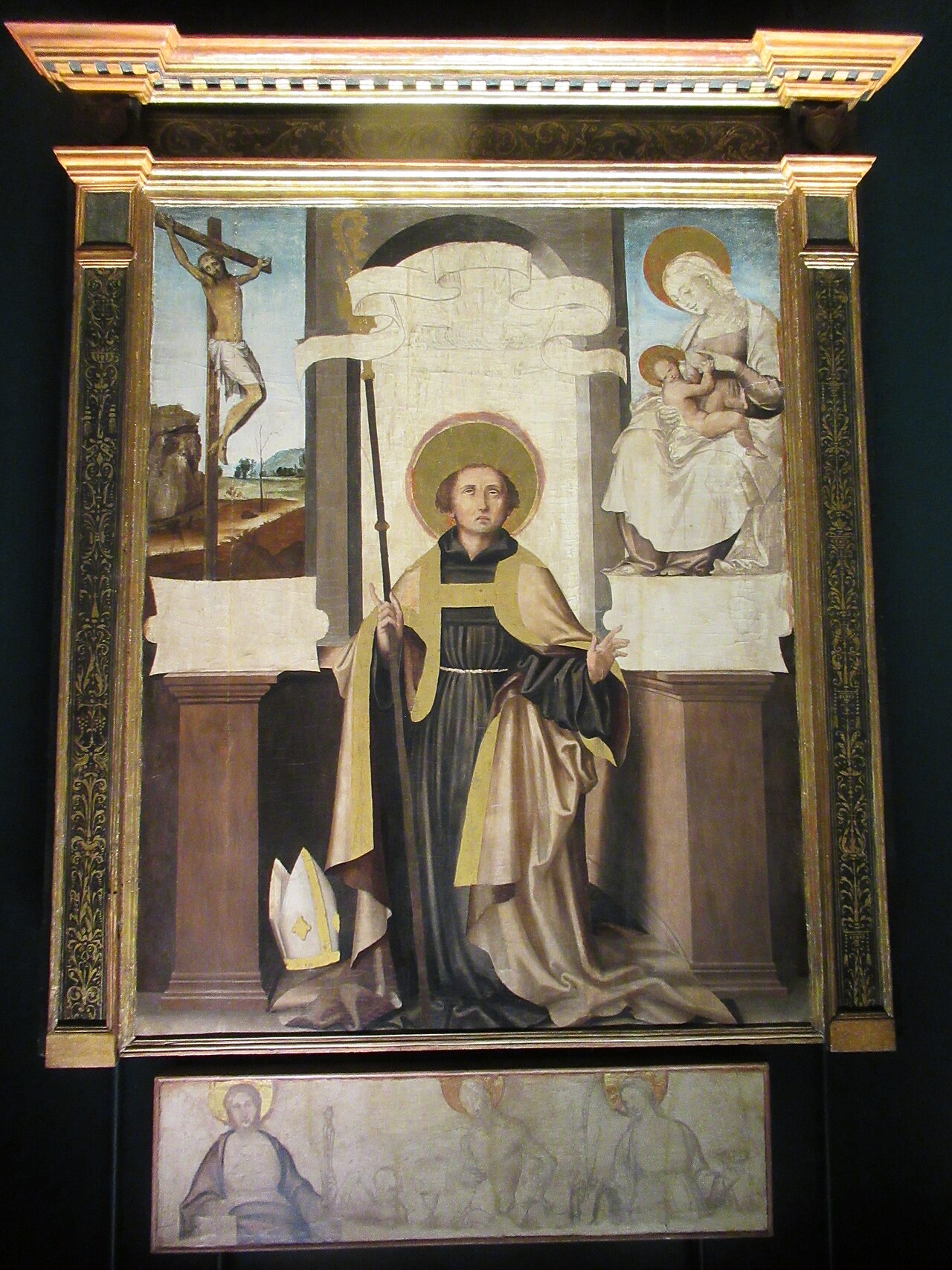 tavola di pietro cavaro con sant agostino in abito nero e stola dorata la mitria a terra il crocifisso e la madonna che allatta