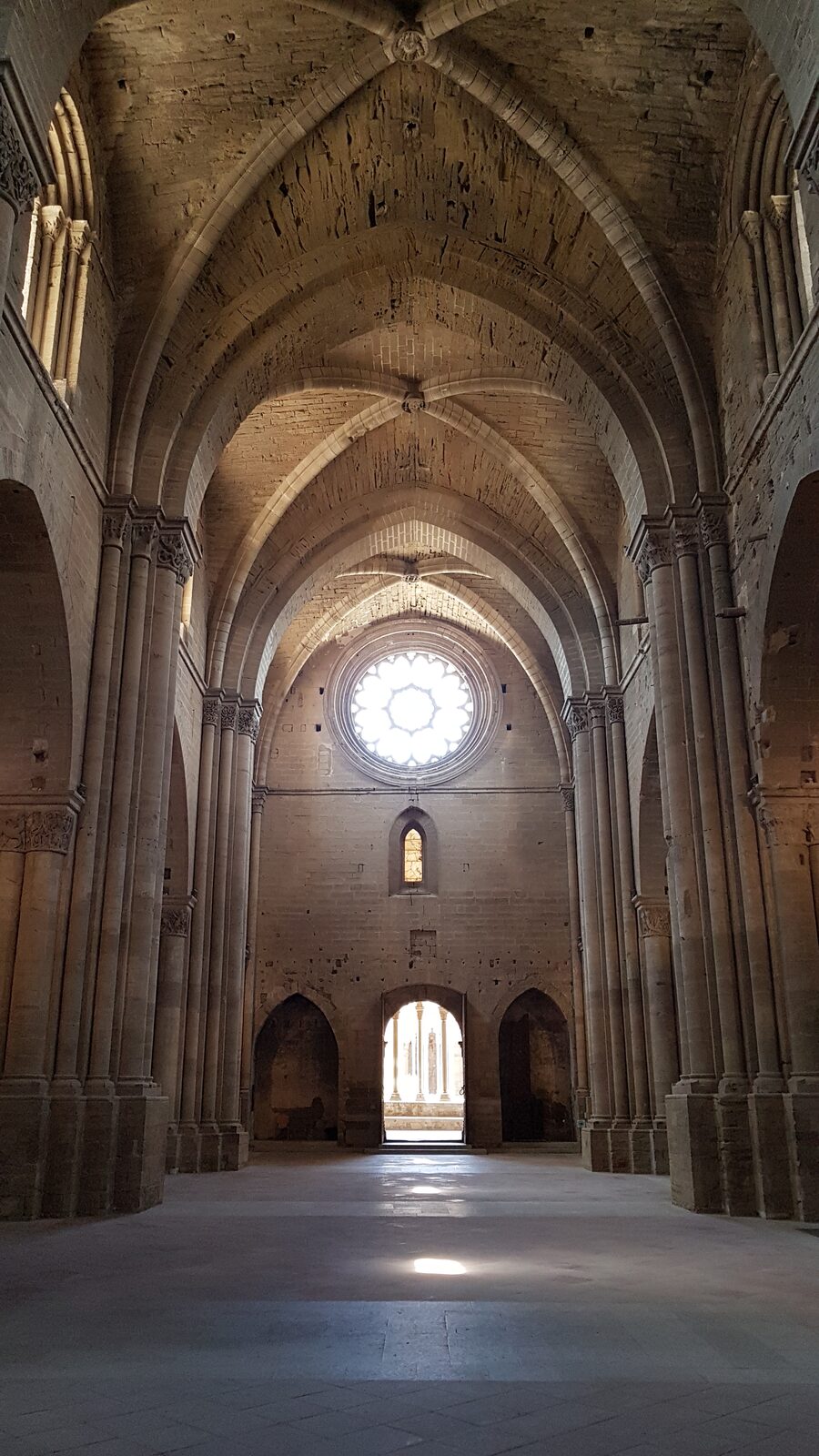 the nave of the Seu Vella towards the rose window and the door onto the cloister
