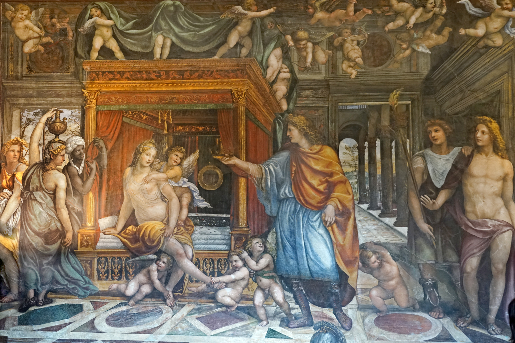 le nozze di alessandro e rossane del sodoma, con rossane seduta sul letto a baldacchino, gli amorini che le tolgono i sandali e il velo e alessandro in mantello arancione che le porge la corona