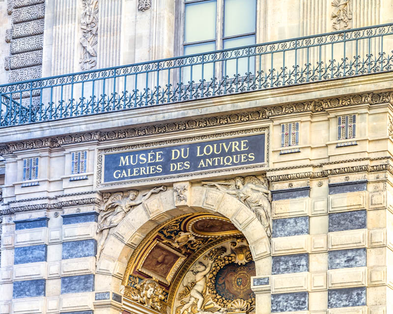 Entrance and sign of the Louvre Museum, Paris